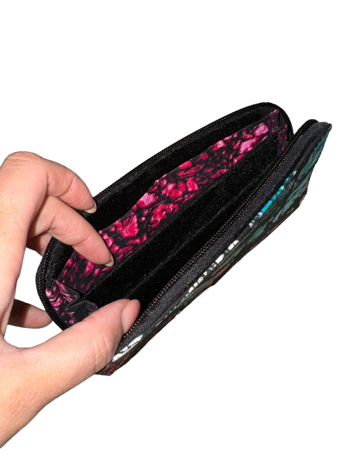 Mowo wallet, with zipper and african print details on the inside of the wallet.