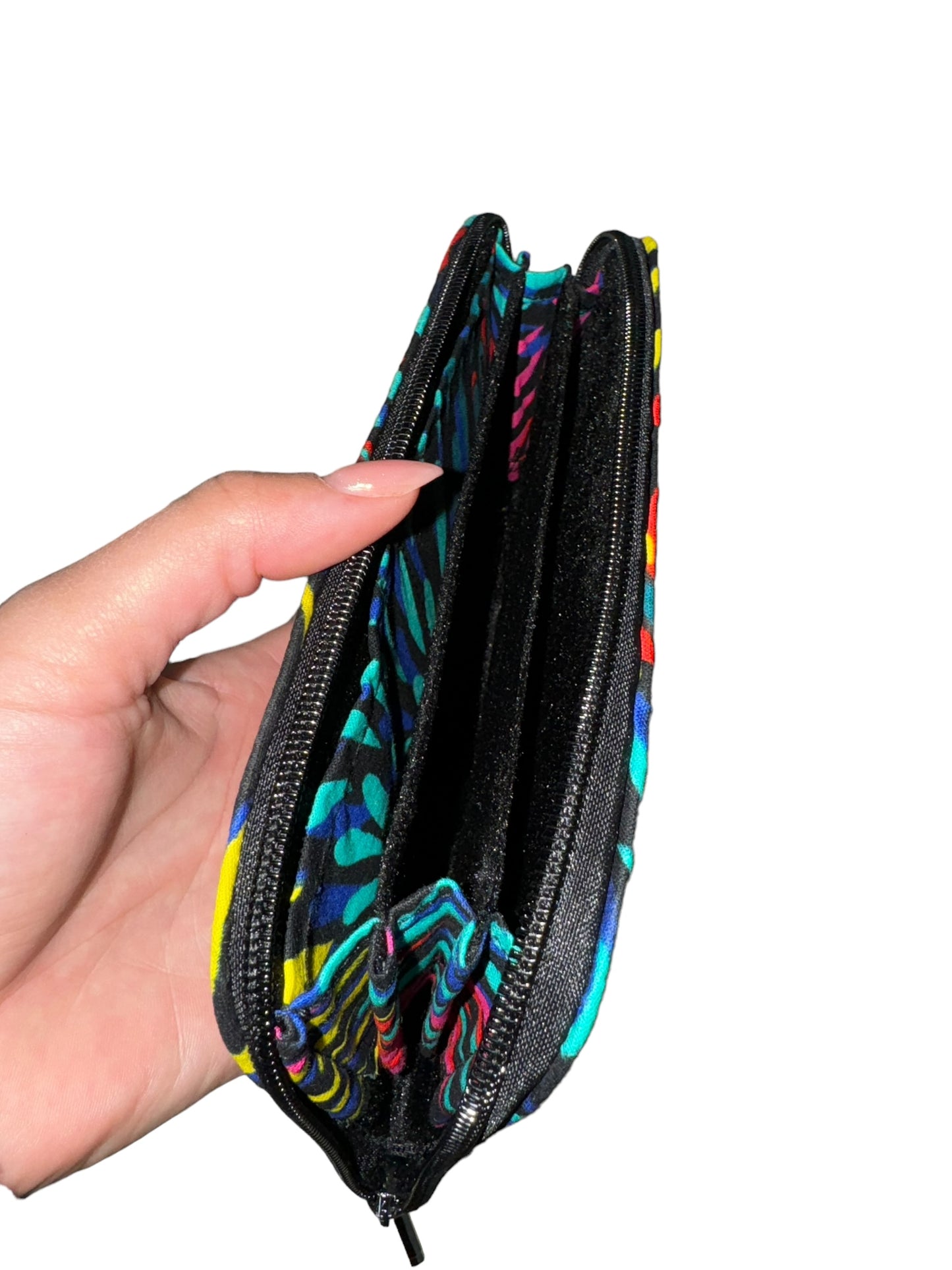 Mowo wallet, with zipper and african print details on the inside of the wallet.